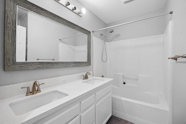 2720 San Jose Ave, Clovis, CA 93611 - full bathroom with tub / shower combination, double vanity, and wood finished floors