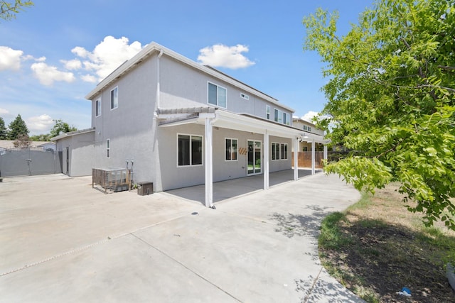 2720 San Jose Ave, Clovis, CA 93611 - back of house with stucco siding, a patio, and a gate