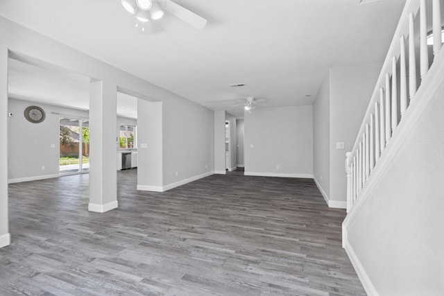 2720 San Jose Ave, Clovis, CA 93611 - unfurnished living room featuring ceiling fan, stairs, and wood finished floors