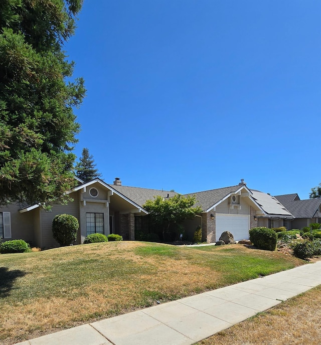 1386 E El Paso Ave, Fresno, CA 93720 - ranch-style home featuring a front yard, an attached garage, and a chimney