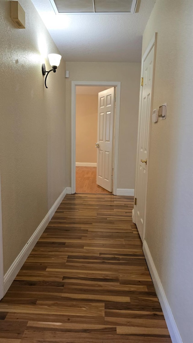 1386 E El Paso Ave, Fresno, CA 93720 - hall featuring dark wood-type flooring and baseboards