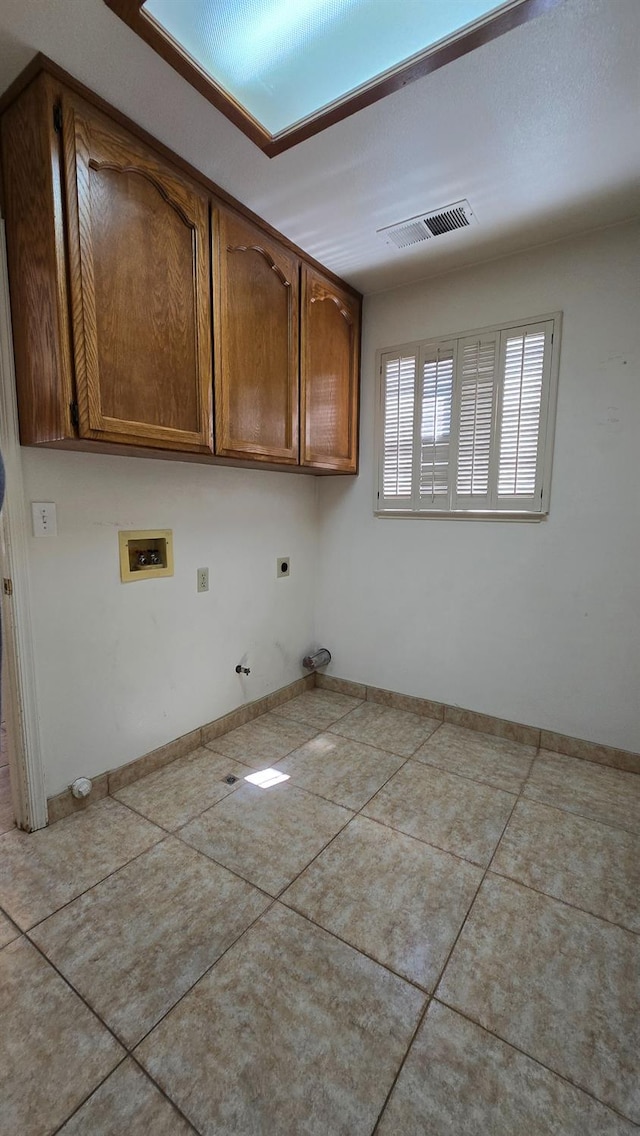 1386 E El Paso Ave, Fresno, CA 93720 - laundry area with hookup for an electric dryer, hookup for a washing machine, hookup for a gas dryer, cabinet space, and tile patterned flooring