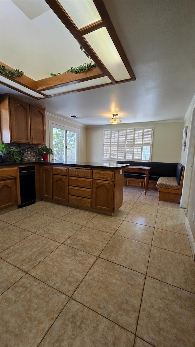 1386 E El Paso Ave, Fresno, CA 93720 - kitchen featuring dark countertops, backsplash, a peninsula, light tile patterned flooring, and crown molding