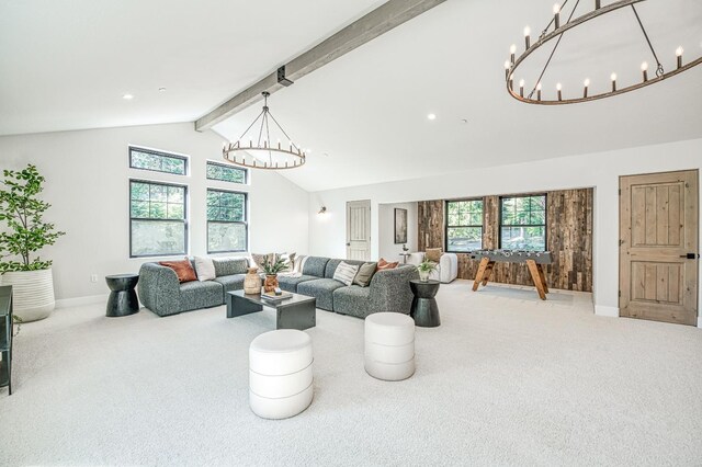 42732 Granite Cir, Shaver Lake, CA 93664 - living area with a chandelier, carpet, healthy amount of natural light, beamed ceiling, and high vaulted ceiling