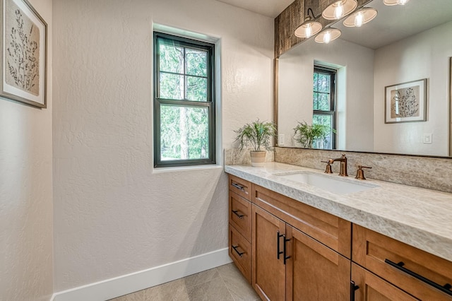 42732 Granite Cir, Shaver Lake, CA 93664 - bathroom featuring healthy amount of natural light, vanity, a textured wall, and a chandelier