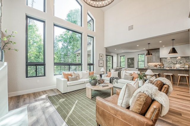 42732 Granite Cir, Shaver Lake, CA 93664 - living room with a towering ceiling and light wood-style flooring