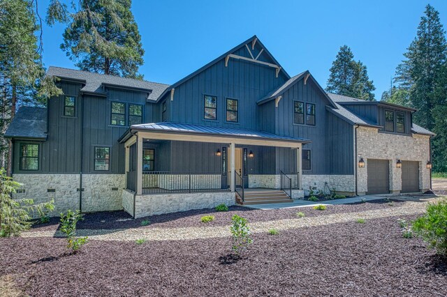 42732 Granite Cir, Shaver Lake, CA 93664 - modern farmhouse with a porch, board and batten siding, stone siding, and a standing seam roof