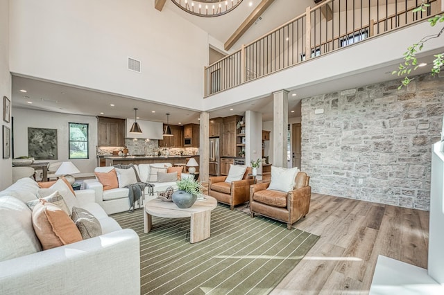42732 Granite Cir, Shaver Lake, CA 93664 - living area featuring light wood-style floors, a towering ceiling, and recessed lighting
