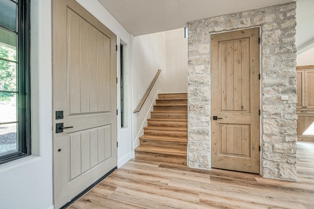 42732 Granite Cir, Shaver Lake, CA 93664 - entryway featuring light wood-type flooring and stairs