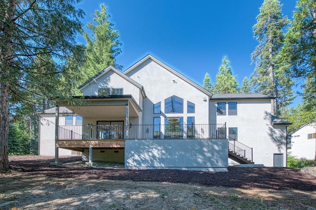 42732 Granite Cir, Shaver Lake, CA 93664 - rear view of house with stucco siding and stairway