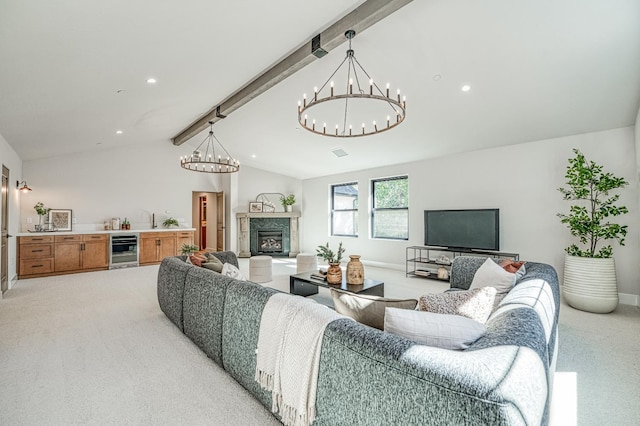 42732 Granite Cir, Shaver Lake, CA 93664 - living area featuring wine cooler, a chandelier, light colored carpet, a fireplace with raised hearth, and recessed lighting