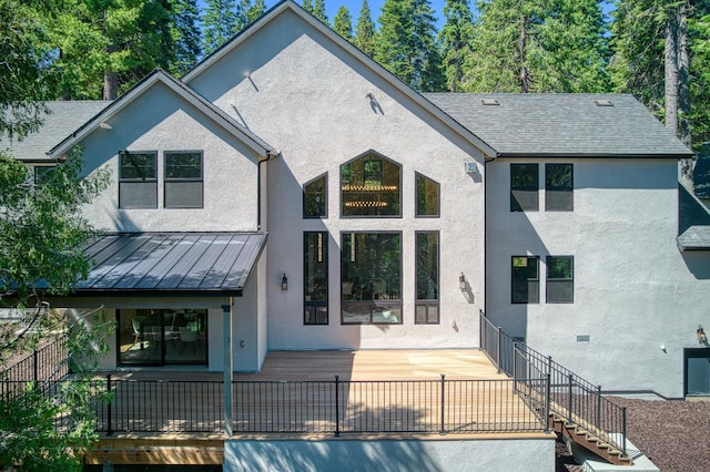 42732 Granite Cir, Shaver Lake, CA 93664 - back of house featuring stucco siding, stairway, a standing seam roof, and a metal roof