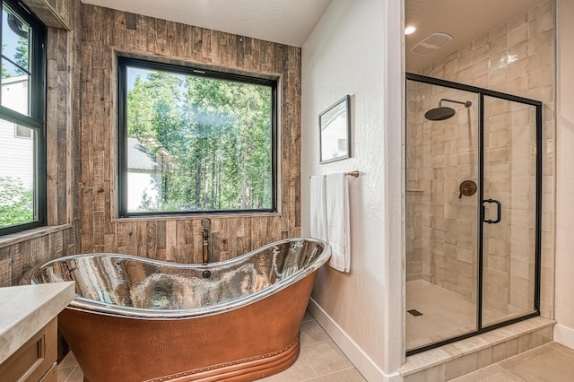 42732 Granite Cir, Shaver Lake, CA 93664 - bathroom with a freestanding tub, tile patterned flooring, a shower stall, and healthy amount of natural light