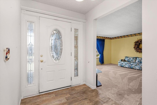 1649 W Menlo, Fresno, CA 93711 - foyer featuring a textured ceiling and wood finished floors