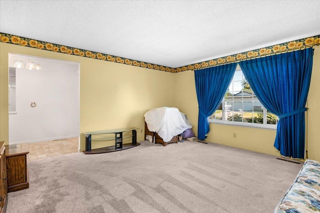 1649 W Menlo, Fresno, CA 93711 - bedroom with carpet, a textured ceiling, and a chandelier