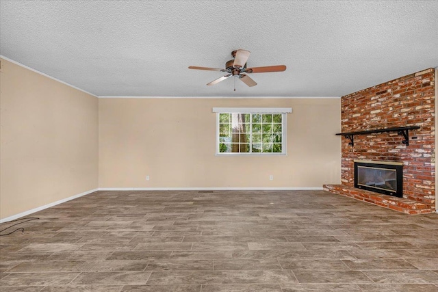 1649 W Menlo, Fresno, CA 93711 - unfurnished living room featuring ceiling fan, a textured ceiling, a brick fireplace, and ornamental molding