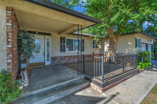 1649 W Menlo, Fresno, CA 93711 - doorway to property featuring stucco siding and brick siding
