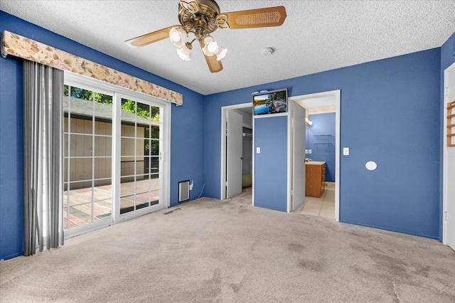 1649 W Menlo, Fresno, CA 93711 - unfurnished bedroom featuring carpet floors, a textured ceiling, access to outside, connected bathroom, and ceiling fan