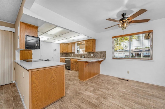 1649 W Menlo, Fresno, CA 93711 - kitchen featuring a peninsula, dishwasher, black electric stovetop, and light countertops