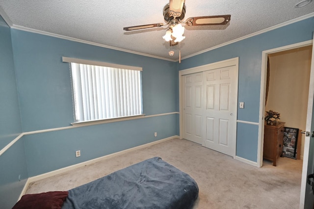 110 N Terry Ave, Clovis, CA 93612 - carpeted bedroom with a textured ceiling, a closet, ornamental molding, and a ceiling fan