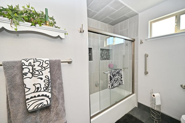 110 N Terry Ave, Clovis, CA 93612 - bathroom featuring combined bath / shower with glass door and toilet