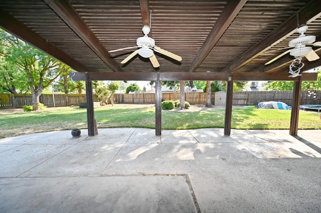 110 N Terry Ave, Clovis, CA 93612 - fenced backyard featuring ceiling fan, a patio area, and a shed