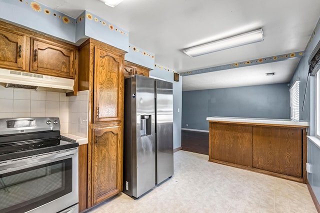 3635 N Hughes, Fresno, CA 93705 - kitchen featuring appliances with stainless steel finishes, under cabinet range hood, brown cabinetry, tile countertops, and light floors