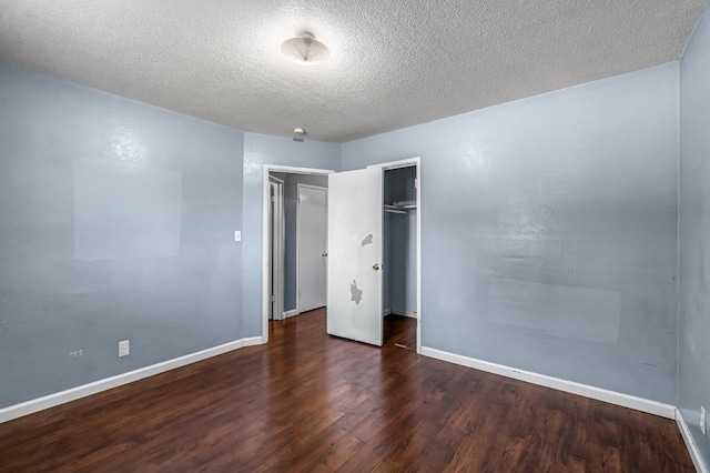 3635 N Hughes, Fresno, CA 93705 - unfurnished bedroom featuring wood finished floors, a closet, and a textured ceiling