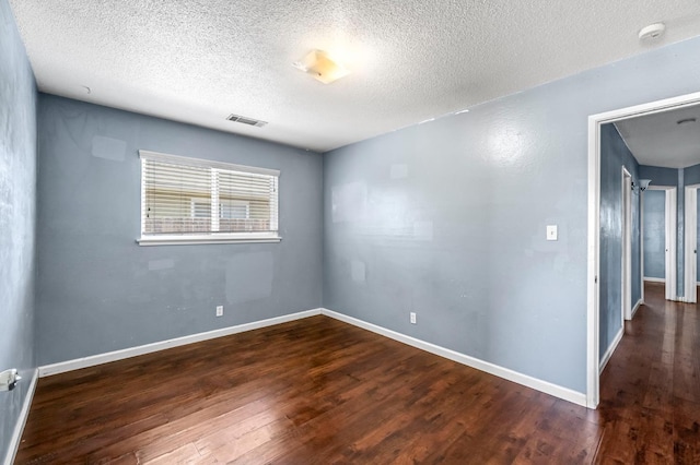 3635 N Hughes, Fresno, CA 93705 - unfurnished room featuring a smoke detector, wood finished floors, and a textured ceiling