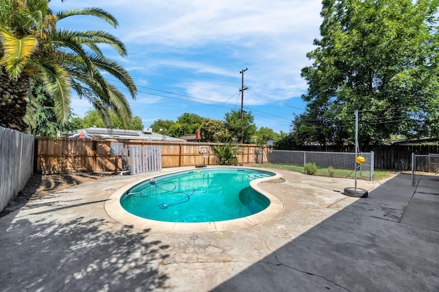 3635 N Hughes, Fresno, CA 93705 - view of swimming pool with a patio area and a fenced backyard
