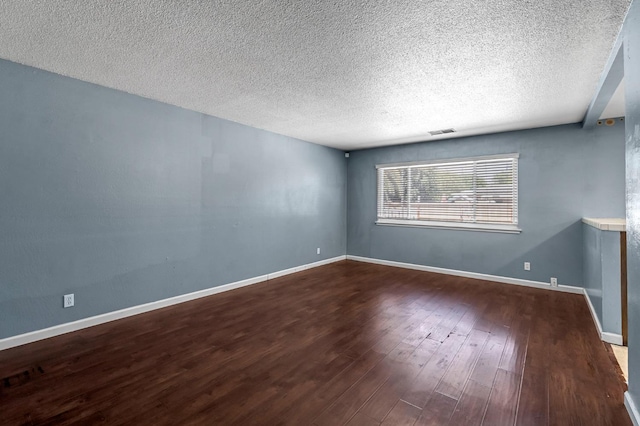 3635 N Hughes, Fresno, CA 93705 - spare room featuring a textured ceiling and wood finished floors