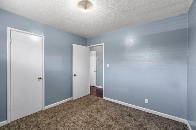 3635 N Hughes, Fresno, CA 93705 - unfurnished bedroom with carpet and a textured ceiling