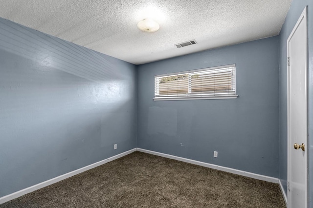 3635 N Hughes, Fresno, CA 93705 - unfurnished room with dark carpet and a textured ceiling