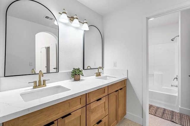 1033 Cypress Ct, Madera, CA 93637 - bathroom with double vanity and tub / shower combination