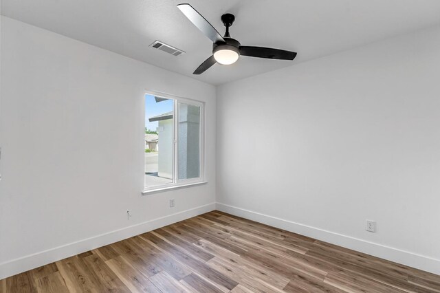 1033 Cypress Ct, Madera, CA 93637 - unfurnished room with light wood-style flooring and ceiling fan