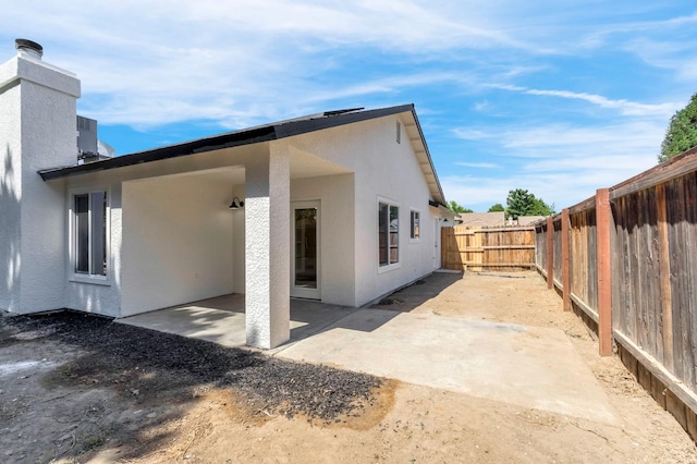 1033 Cypress Ct, Madera, CA 93637 - back of house with a patio, a fenced backyard, and stucco siding