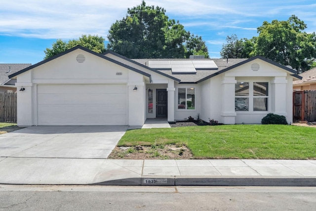 1033 Cypress Ct, Madera, CA 93637 - ranch-style home with solar panels, an attached garage, roof with shingles, stucco siding, and concrete driveway