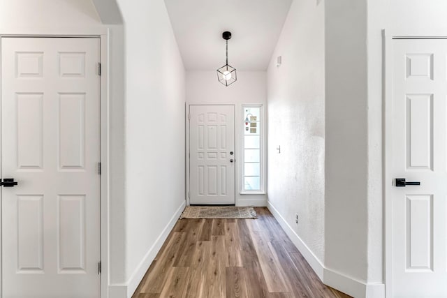 1033 Cypress Ct, Madera, CA 93637 - foyer featuring wood finished floors and arched walkways