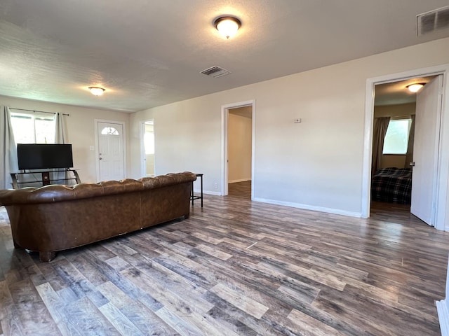 2405 E White Ave, Fresno, CA 93701 - living area with dark wood-style floors and healthy amount of natural light