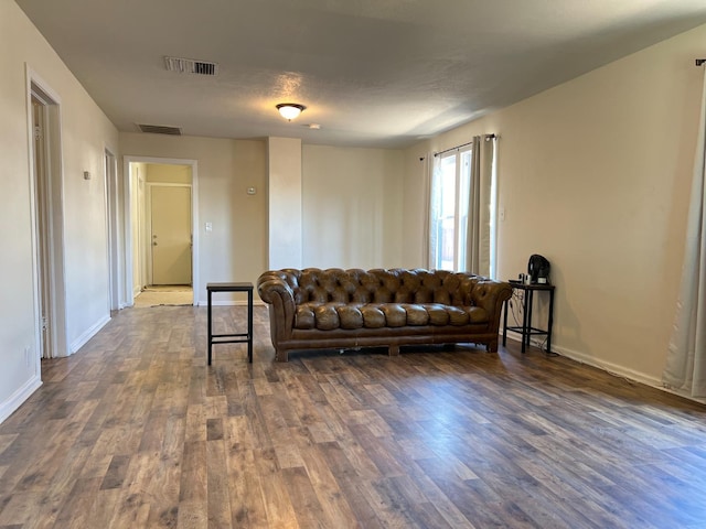 2405 E White Ave, Fresno, CA 93701 - living area featuring dark wood-type flooring
