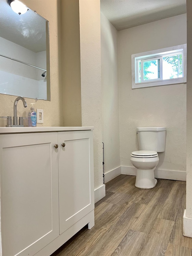 2405 E White Ave, Fresno, CA 93701 - bathroom featuring wood finished floors and vanity