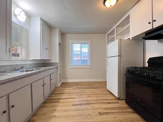 2405 E White Ave, Fresno, CA 93701 - kitchen featuring gas stove, light wood-style flooring, white cabinetry, open shelves, and under cabinet range hood