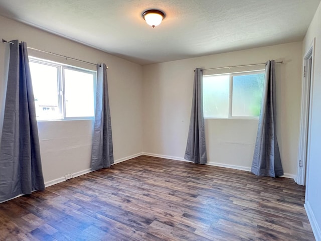 2405 E White Ave, Fresno, CA 93701 - spare room with wood finished floors and healthy amount of natural light