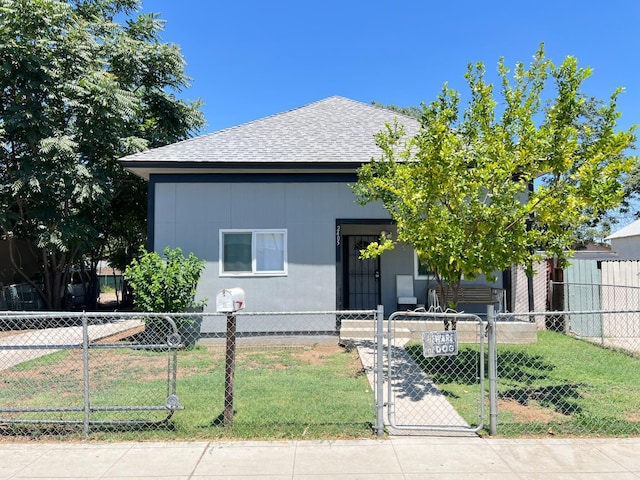 2405 E White Ave, Fresno, CA 93701 - view of front of property featuring a fenced front yard, a gate, and a shingled roof