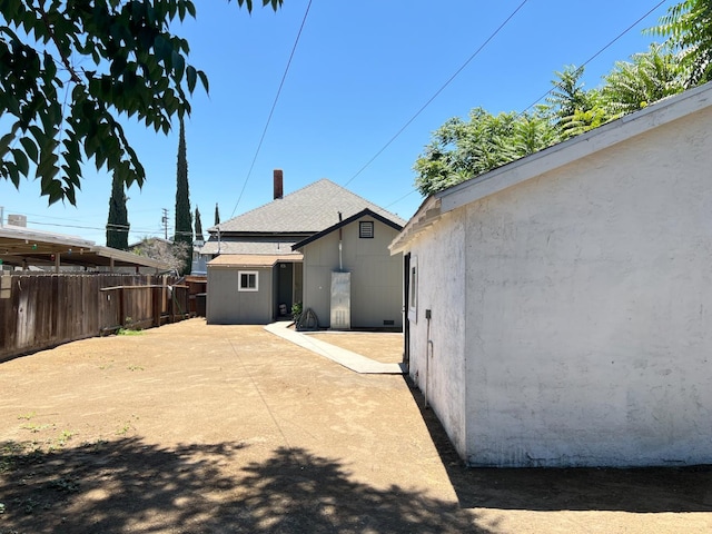 2405 E White Ave, Fresno, CA 93701 - rear view of property featuring an outbuilding
