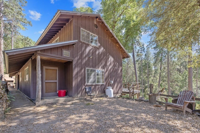 48675 Todd Eymann Rd, Miramonte, CA 93641 - rear view of property with board and batten siding
