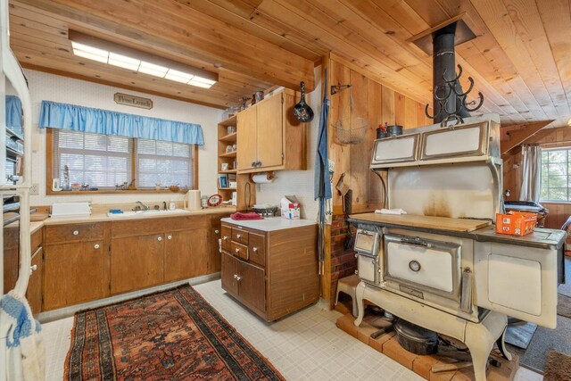 48675 Todd Eymann Rd, Miramonte, CA 93641 - kitchen with wood ceiling, open shelves, brown cabinetry, light countertops, and wood walls