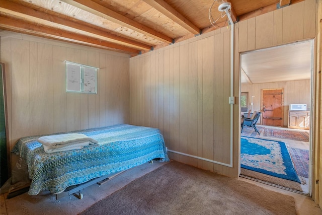 48675 Todd Eymann Rd, Miramonte, CA 93641 - bedroom with wooden walls, beam ceiling, and carpet