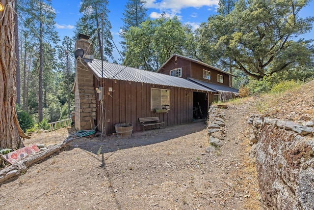 48675 Todd Eymann Rd, Miramonte, CA 93641 - view of front facade with a metal roof, a chimney, and board and batten siding