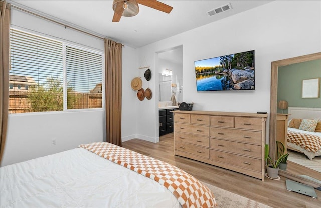 627 S Kandarian Ave, Fowler, CA 93625 - bedroom featuring light wood-type flooring, connected bathroom, and a ceiling fan